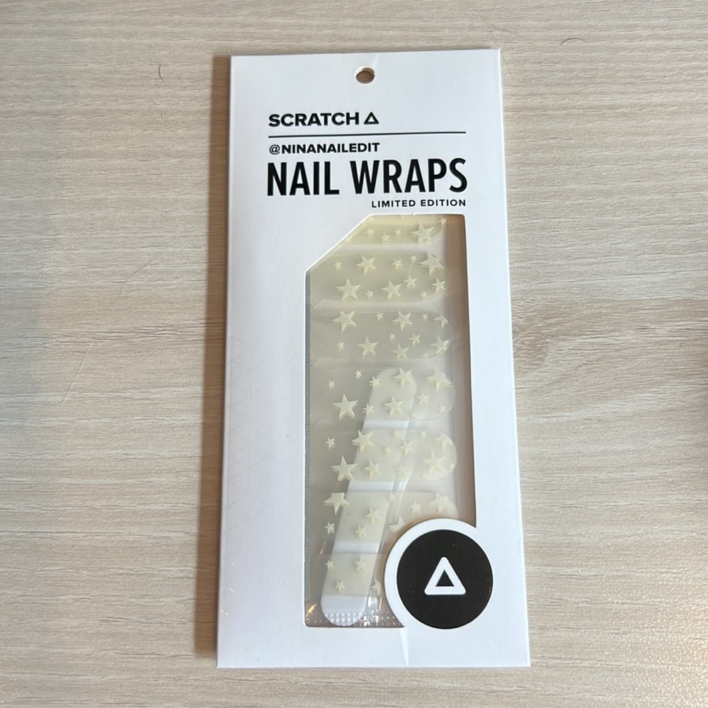 Scratch nail wraps in white star pattern. Cute for celebrating holiday